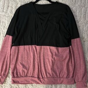 Black and Pink Top with criss cross design at the neckline.  Women’s Size Medium